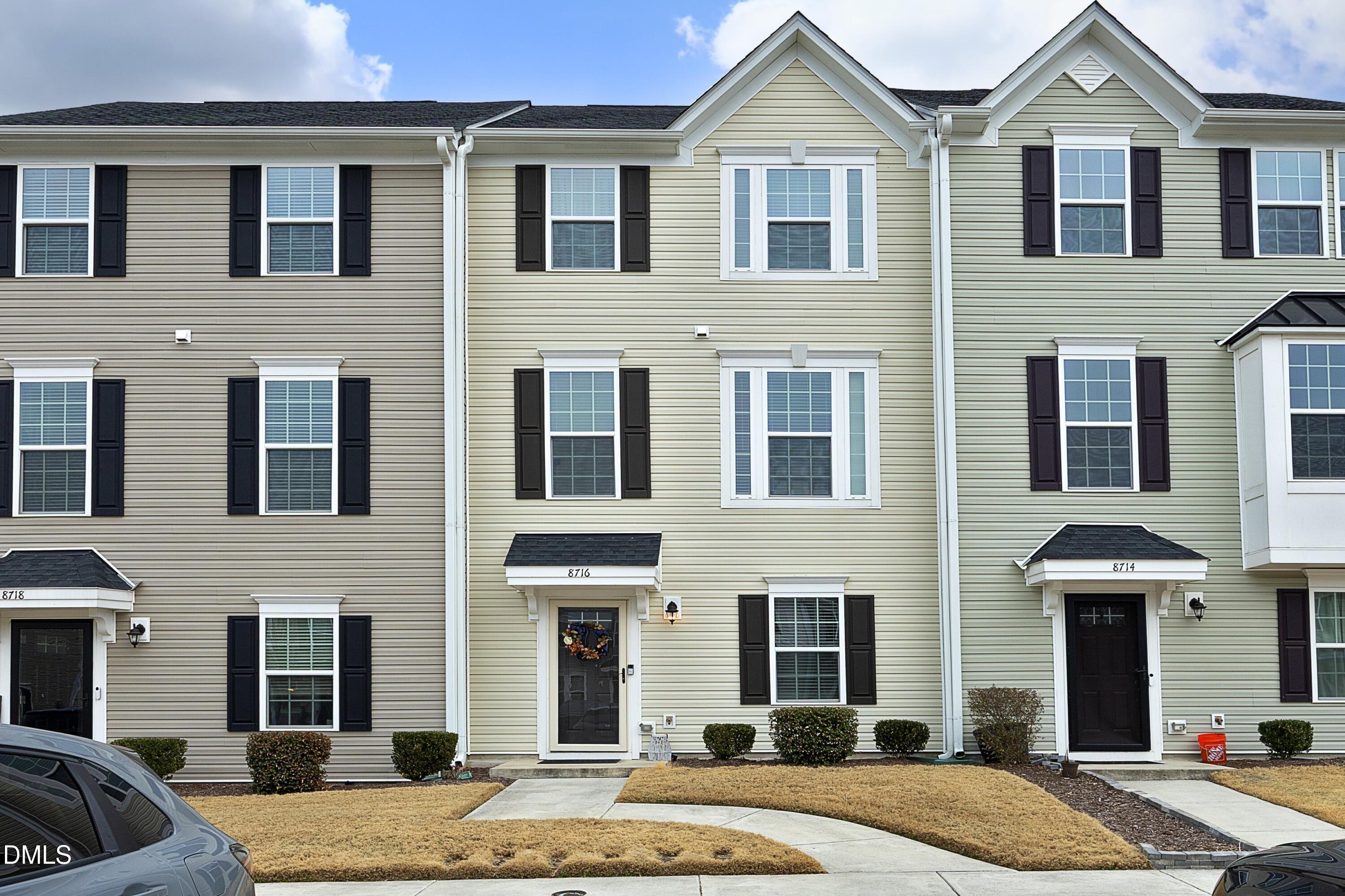 8716 Red Canyon Way Raleigh, NC 27616 - Photo 1 of 36 a front view of a house with a garden