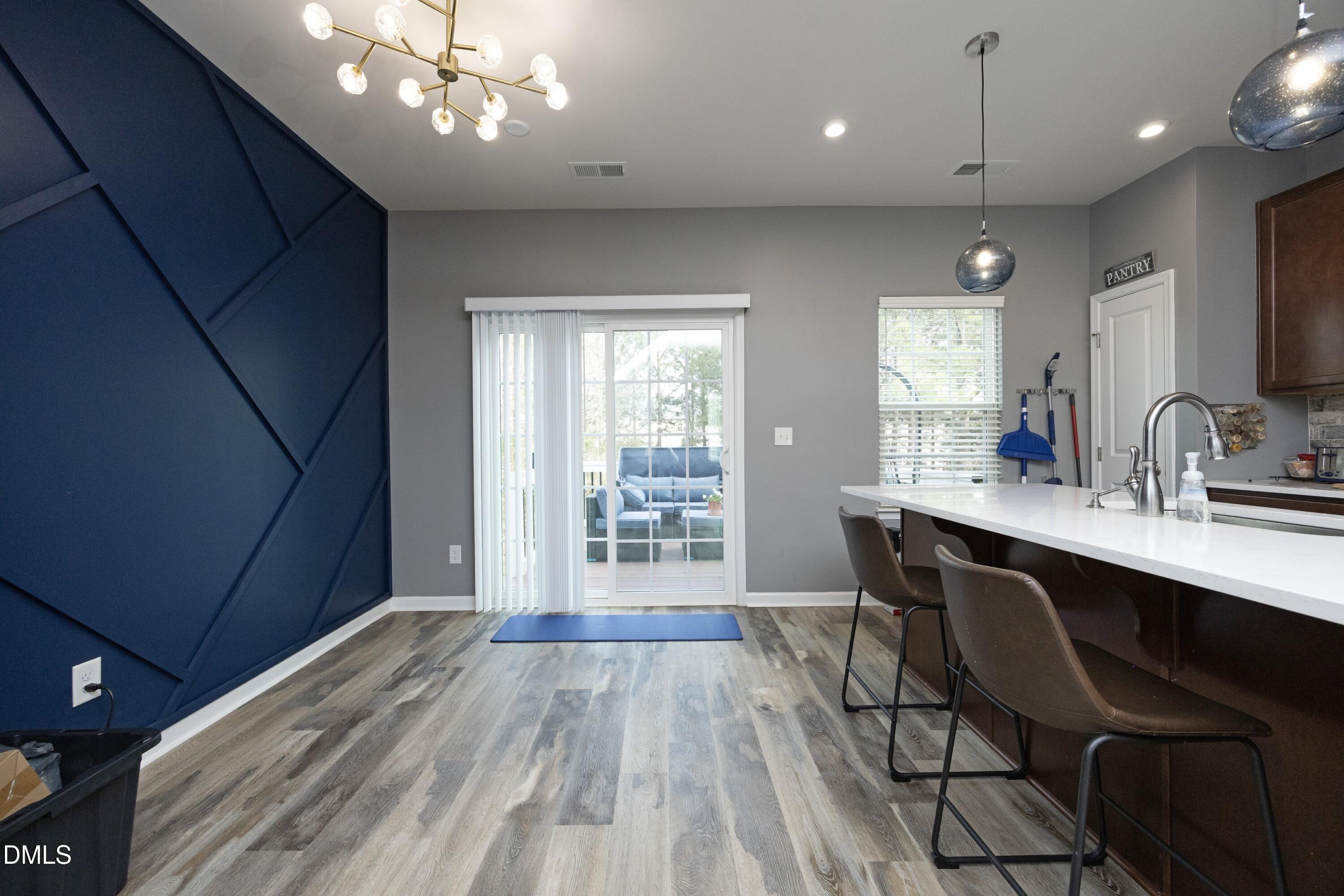8716 Red Canyon Way Raleigh, NC 27616 - Photo 12 of 36 a view of a dining room with furniture window and wooden floor