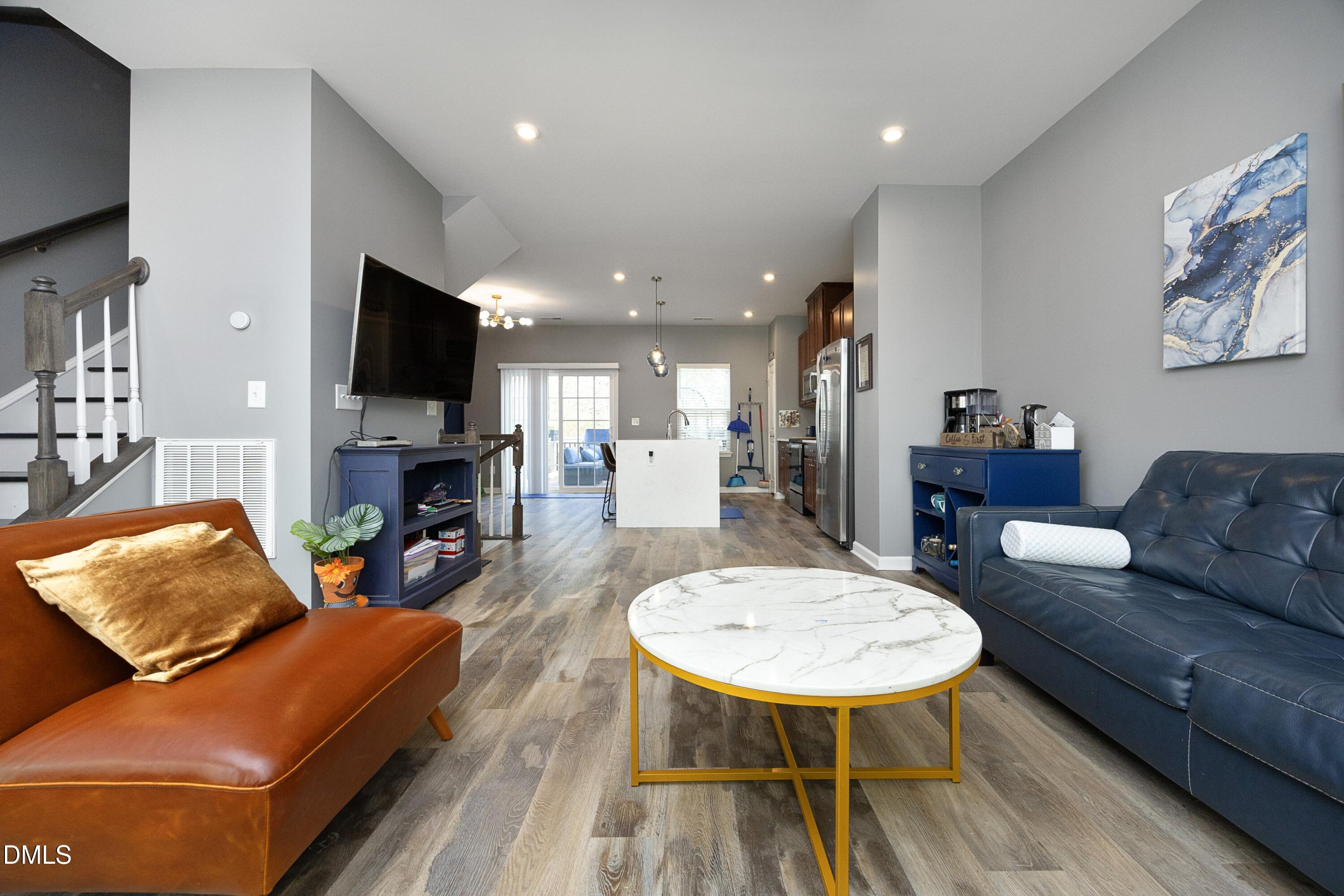 8716 Red Canyon Way Raleigh, NC 27616 - Photo 14 of 36 a living room with furniture and a flat screen tv