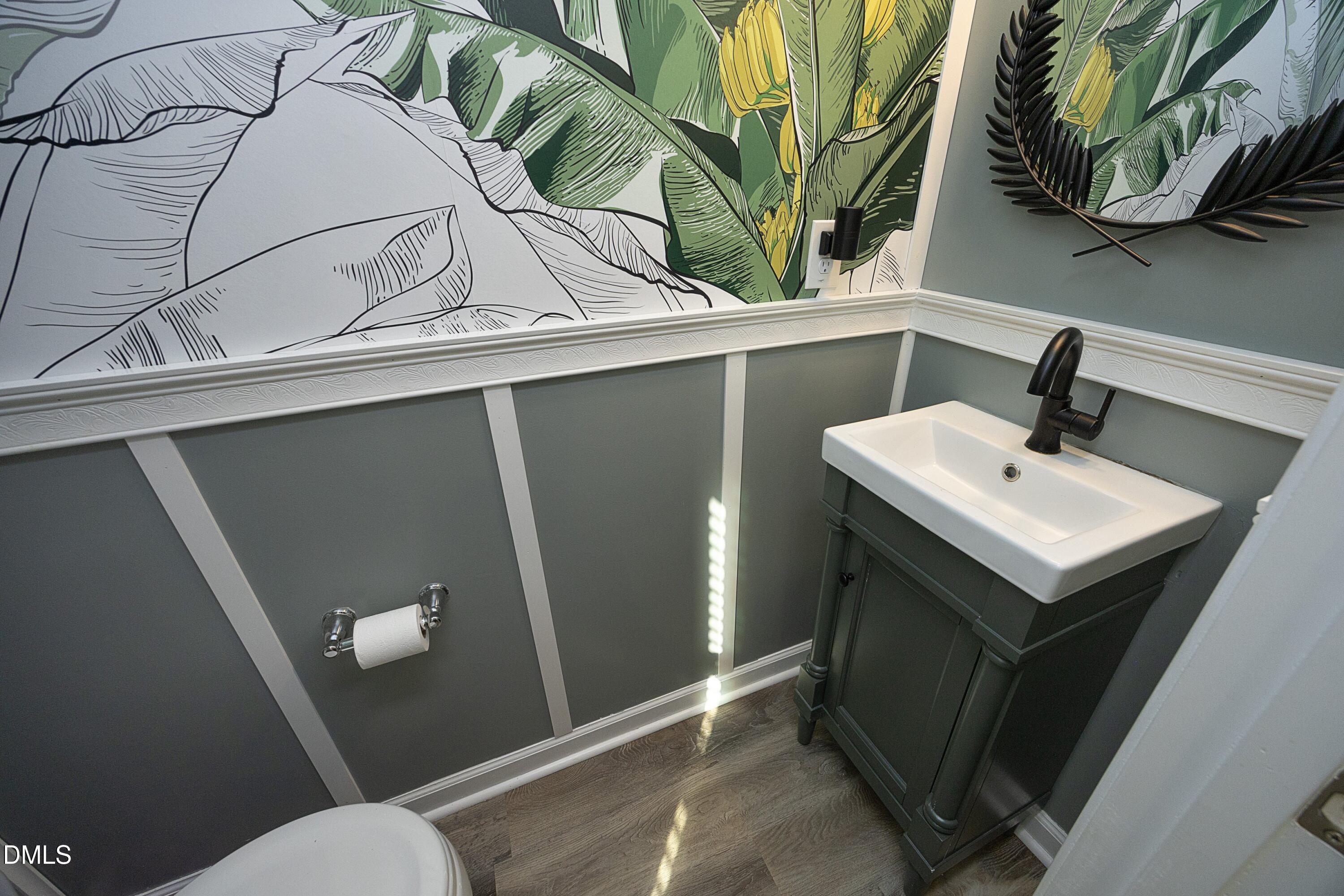 8716 Red Canyon Way Raleigh, NC 27616 - Photo 18 of 36 a bathroom with a sink and mirror