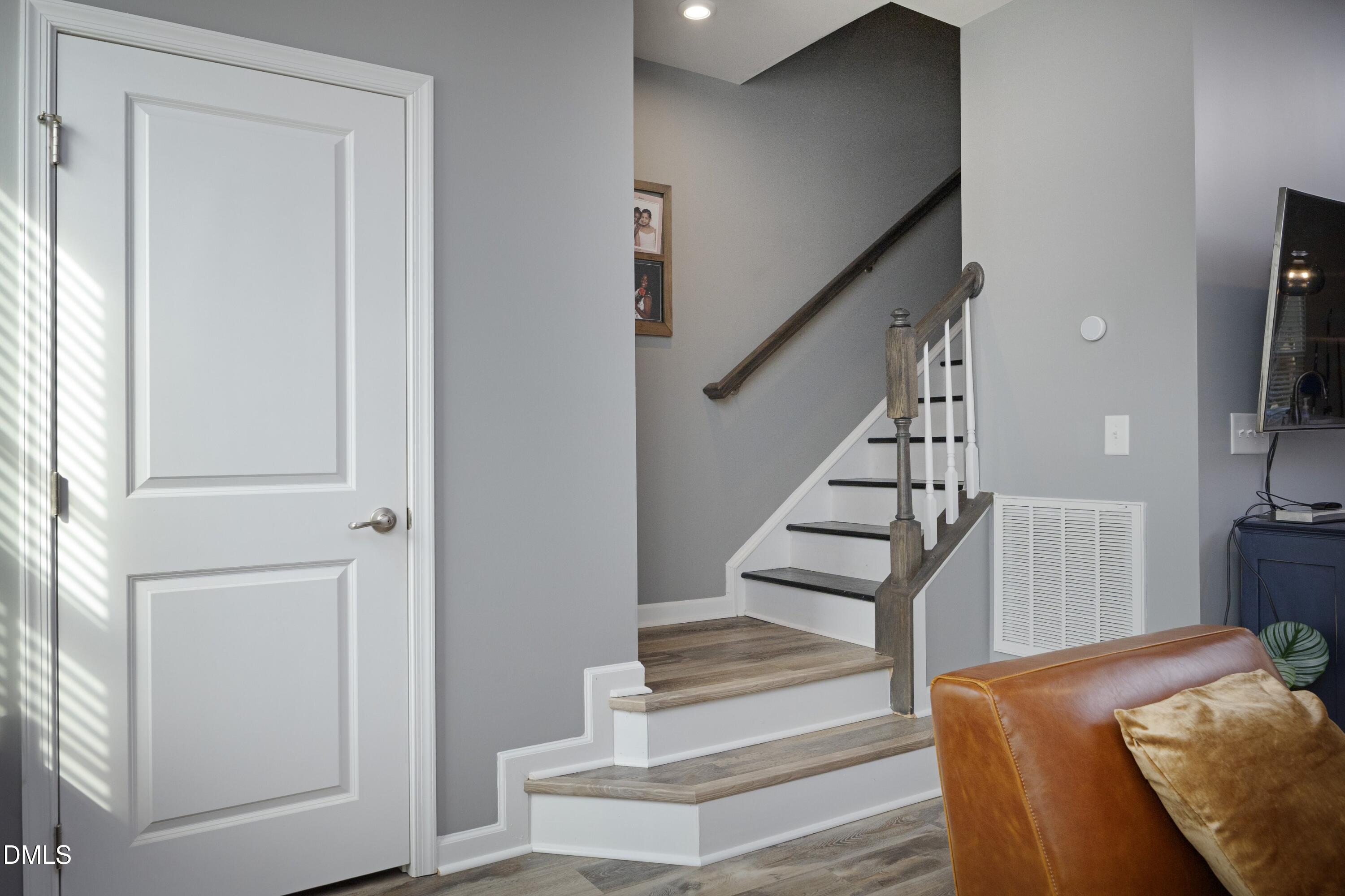 8716 Red Canyon Way Raleigh, NC 27616 - Photo 19 of 36 a view of entryway and hall with wooden floor