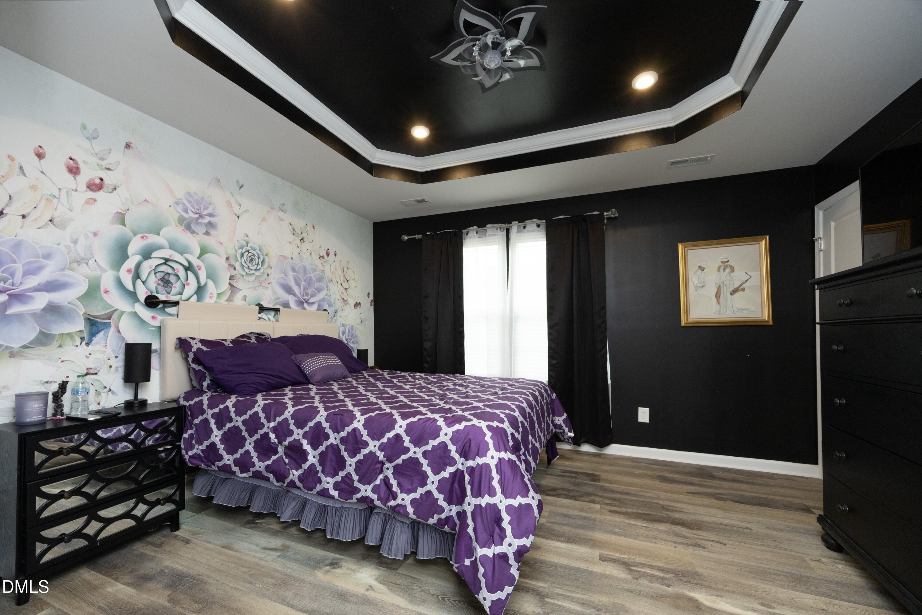 8716 Red Canyon Way Raleigh, NC 27616 - Photo 20 of 36 a bedroom with a large bed and a window