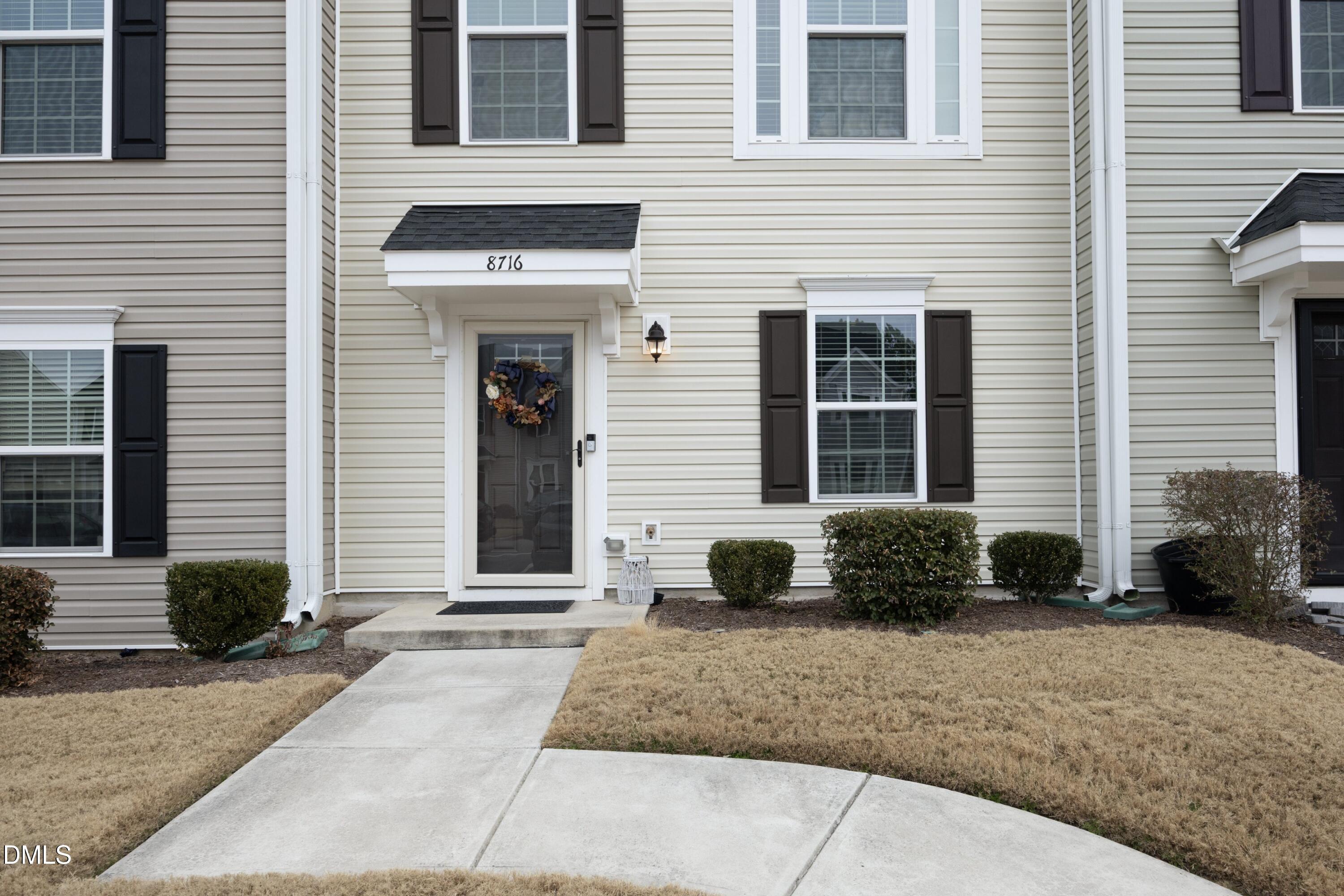 8716 Red Canyon Way Raleigh, NC 27616 - Photo 2 of 36 a front view of a house with a yard