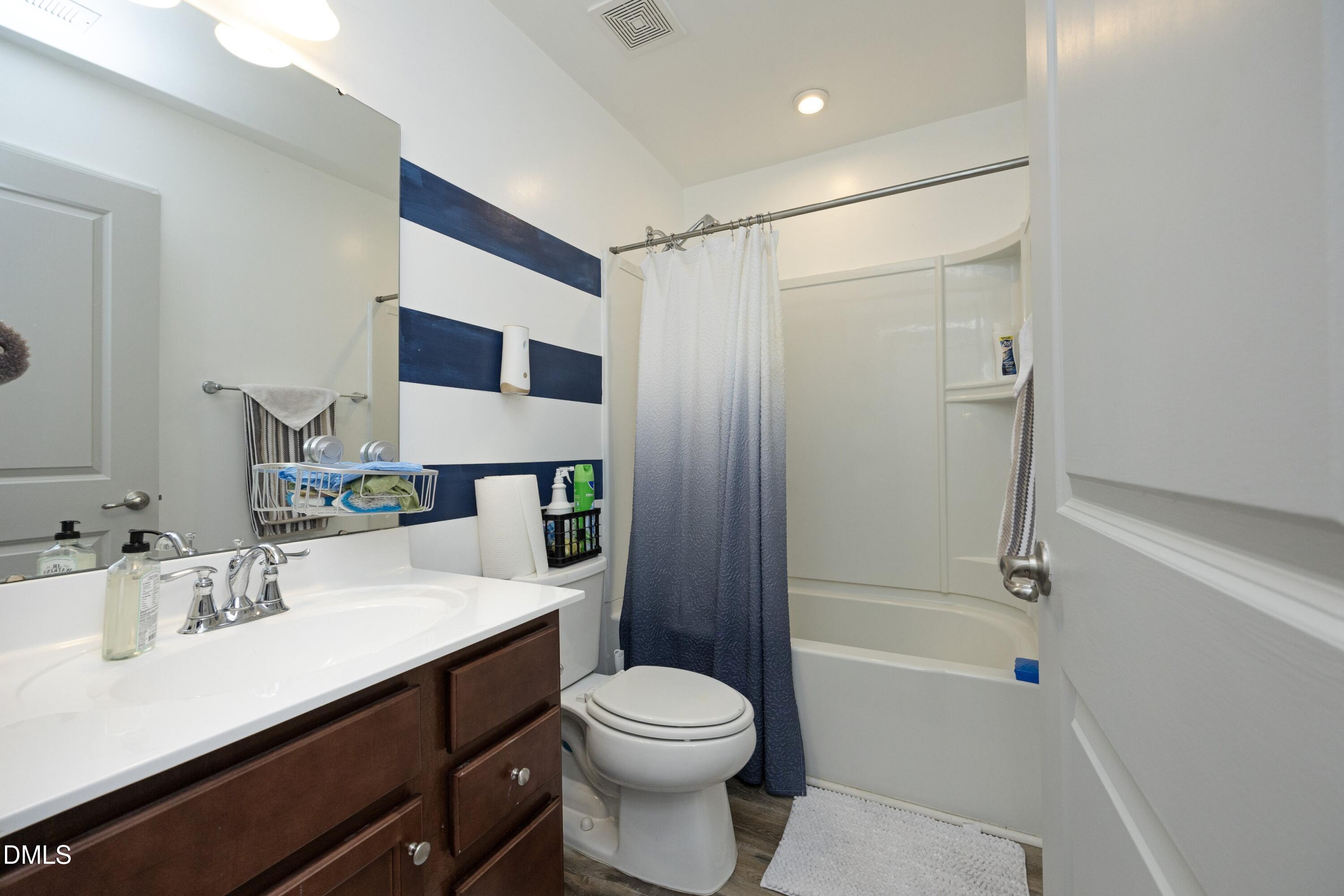 8716 Red Canyon Way Raleigh, NC 27616 - Photo 22 of 36 a bathroom with a sink toilet and shower