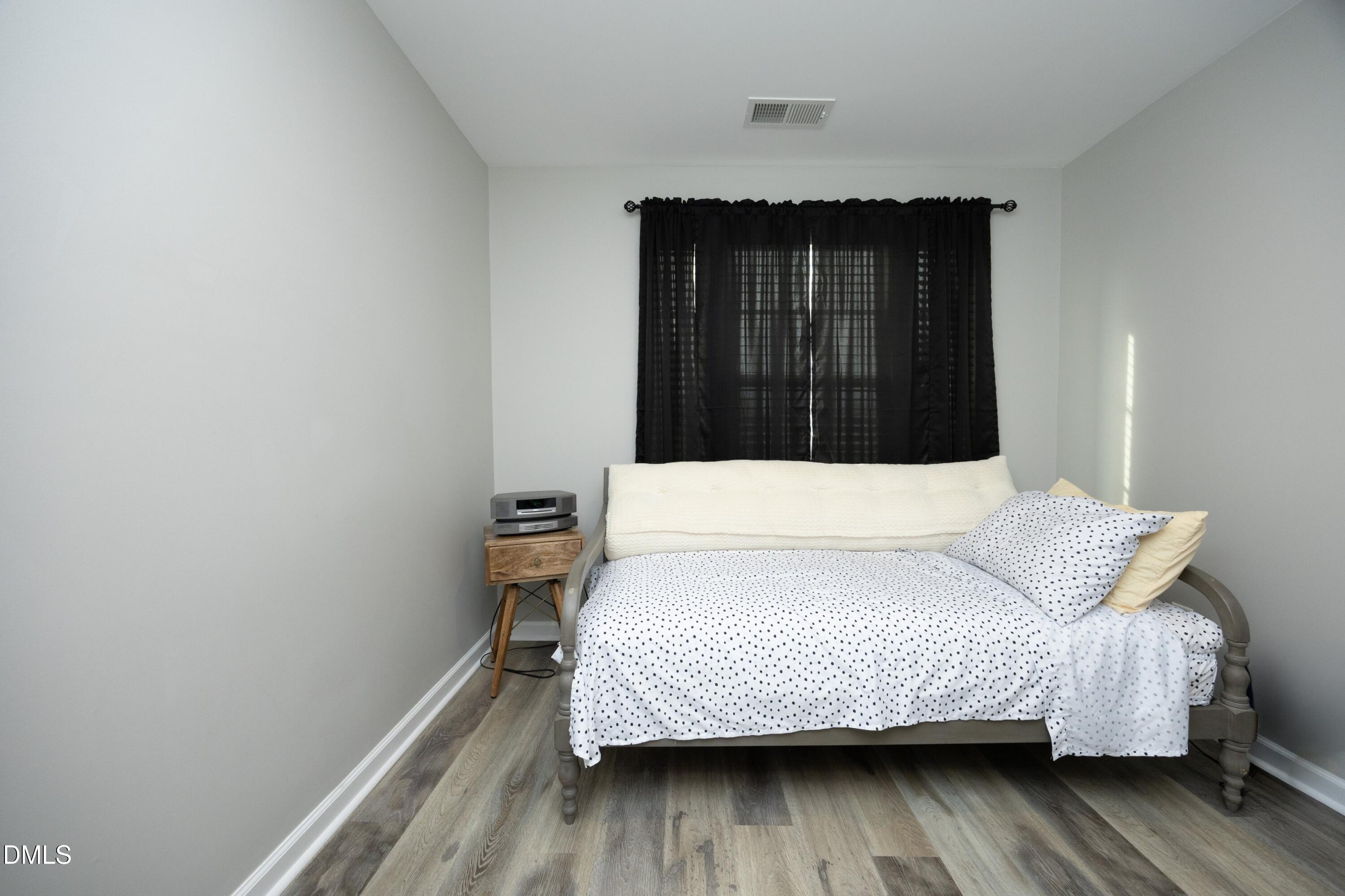 8716 Red Canyon Way Raleigh, NC 27616 - Photo 23 of 36 a bedroom with a bed and a window