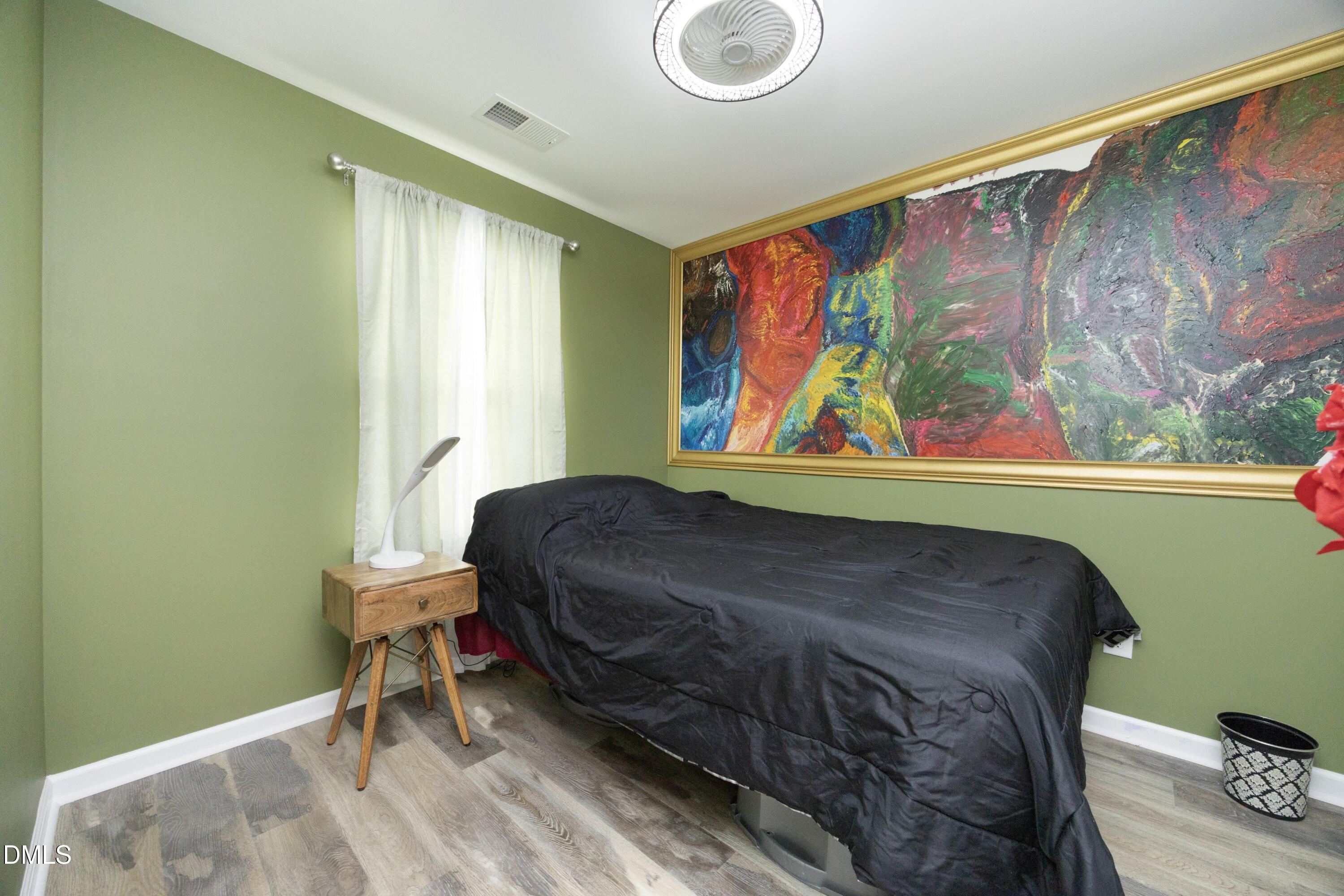 8716 Red Canyon Way Raleigh, NC 27616 - Photo 24 of 36 a bedroom with a bed window and a chair