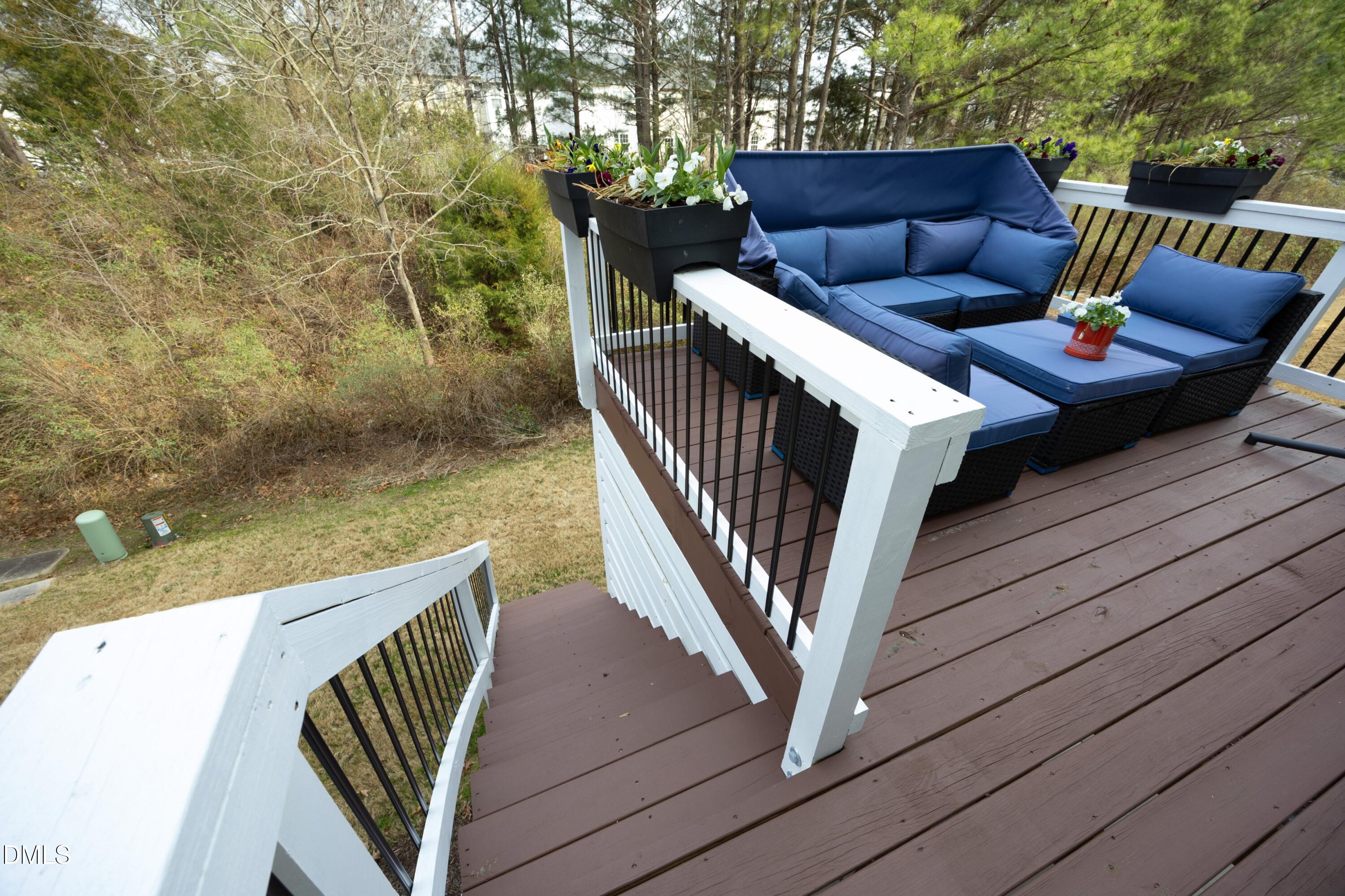 8716 Red Canyon Way Raleigh, NC 27616 - Photo 27 of 36 a view of couches in the balcony with wooden floor