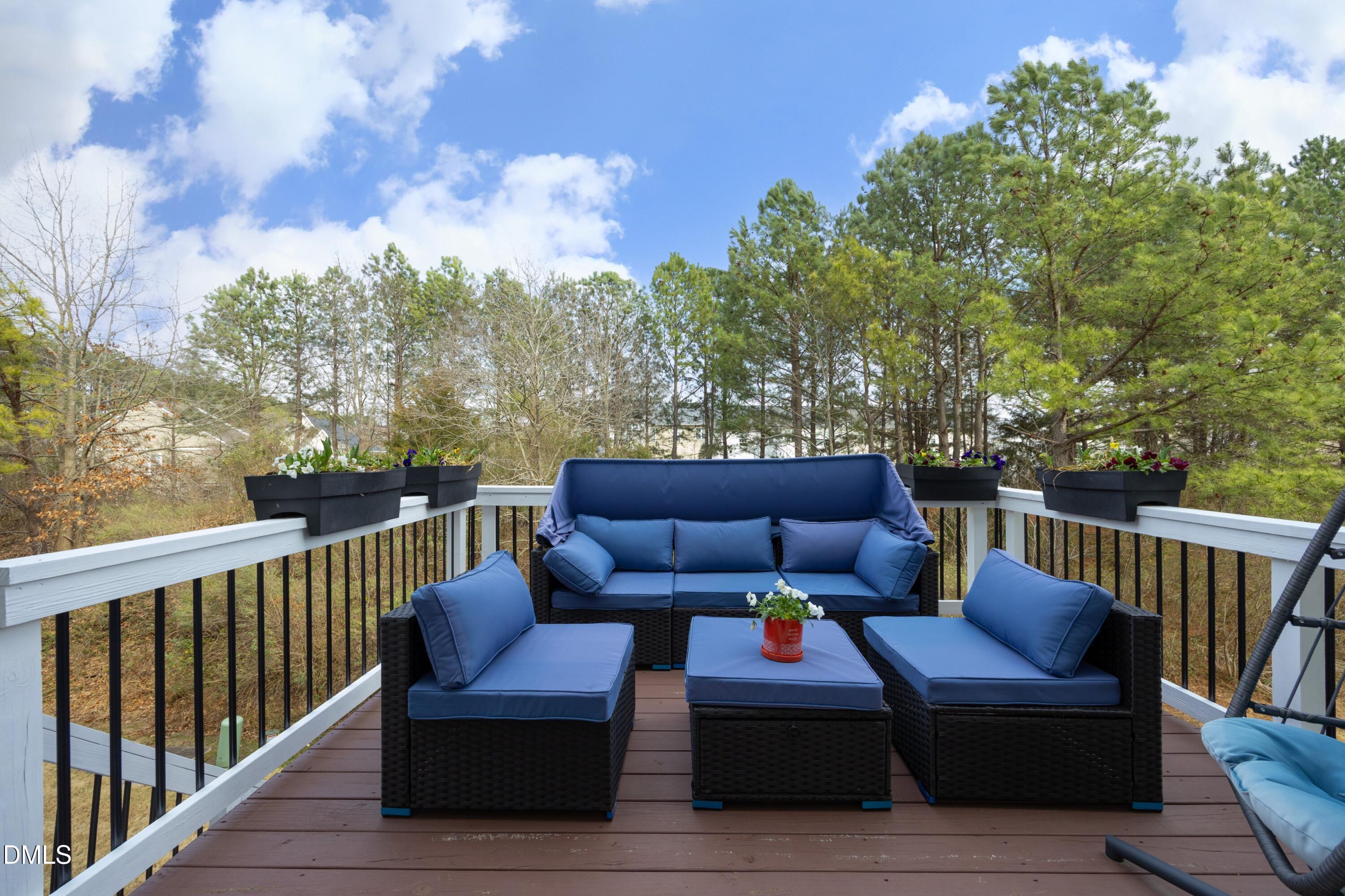 8716 Red Canyon Way Raleigh, NC 27616 - Photo 29 of 36 a roof deck with couches and wooden fence