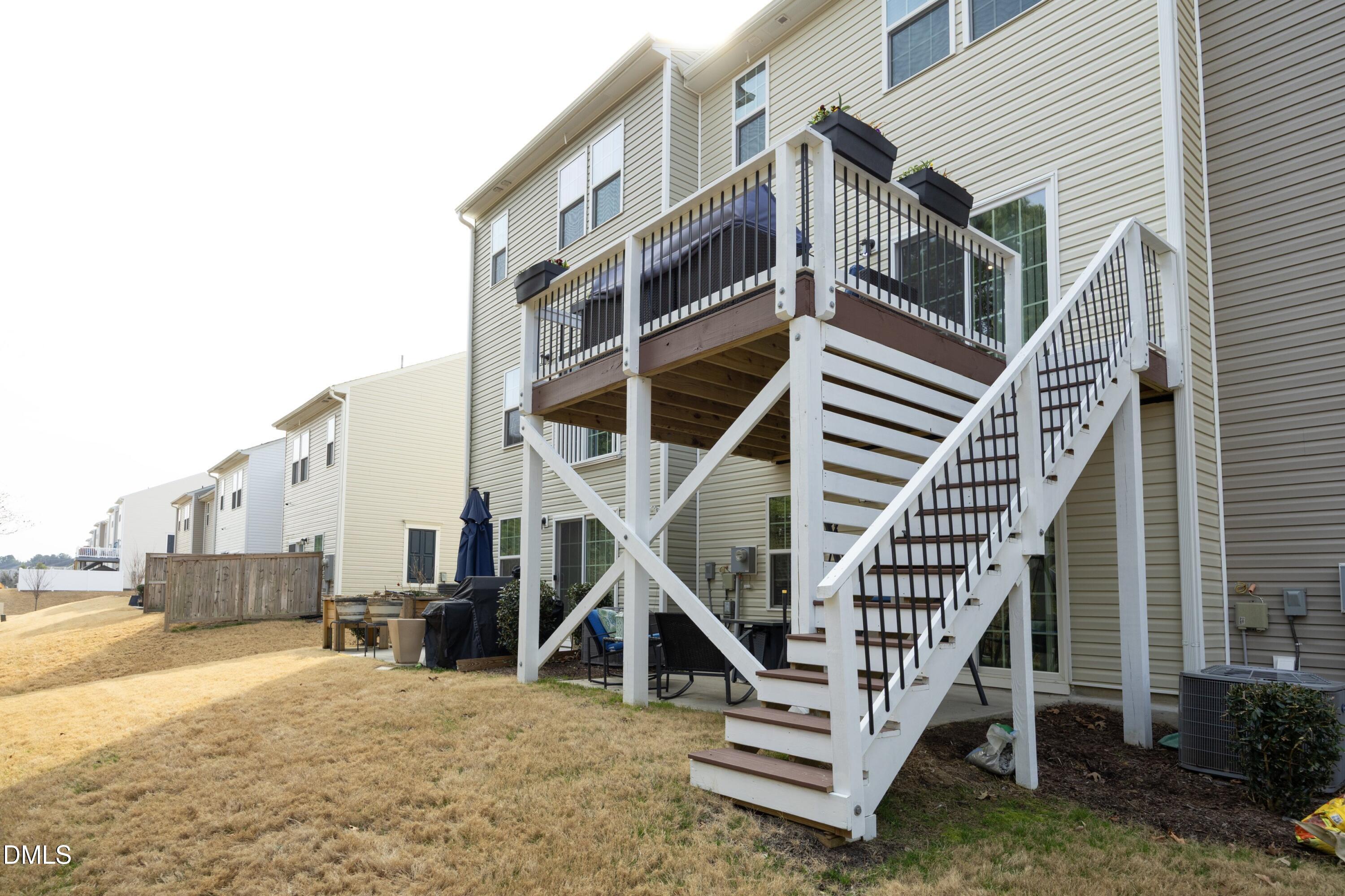 8716 Red Canyon Way Raleigh, NC 27616 - Photo 31 of 36 a view of a house with backyard and deck