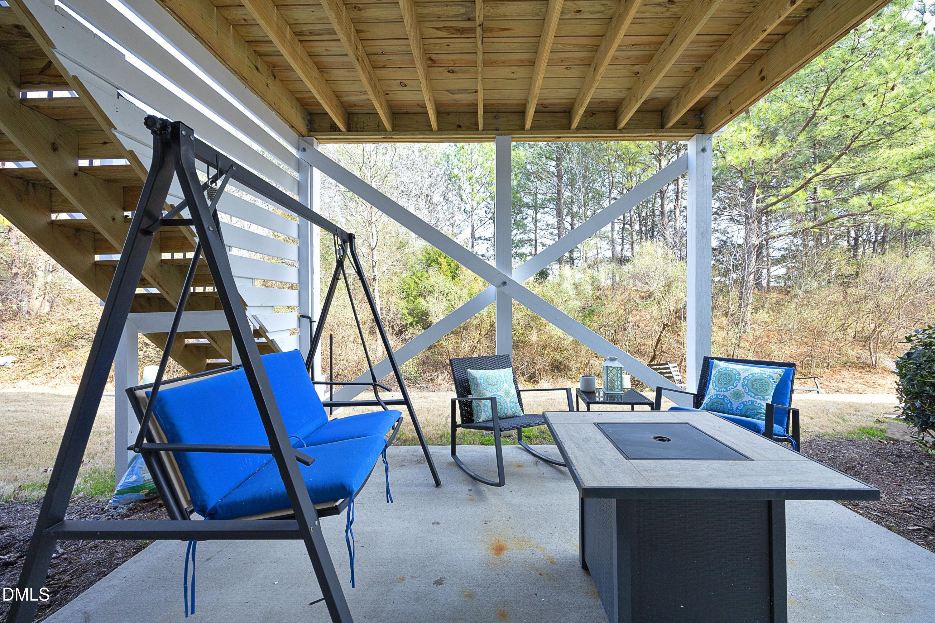 8716 Red Canyon Way Raleigh, NC 27616 - Photo 32 of 36 a roof deck with table and chairs and couches