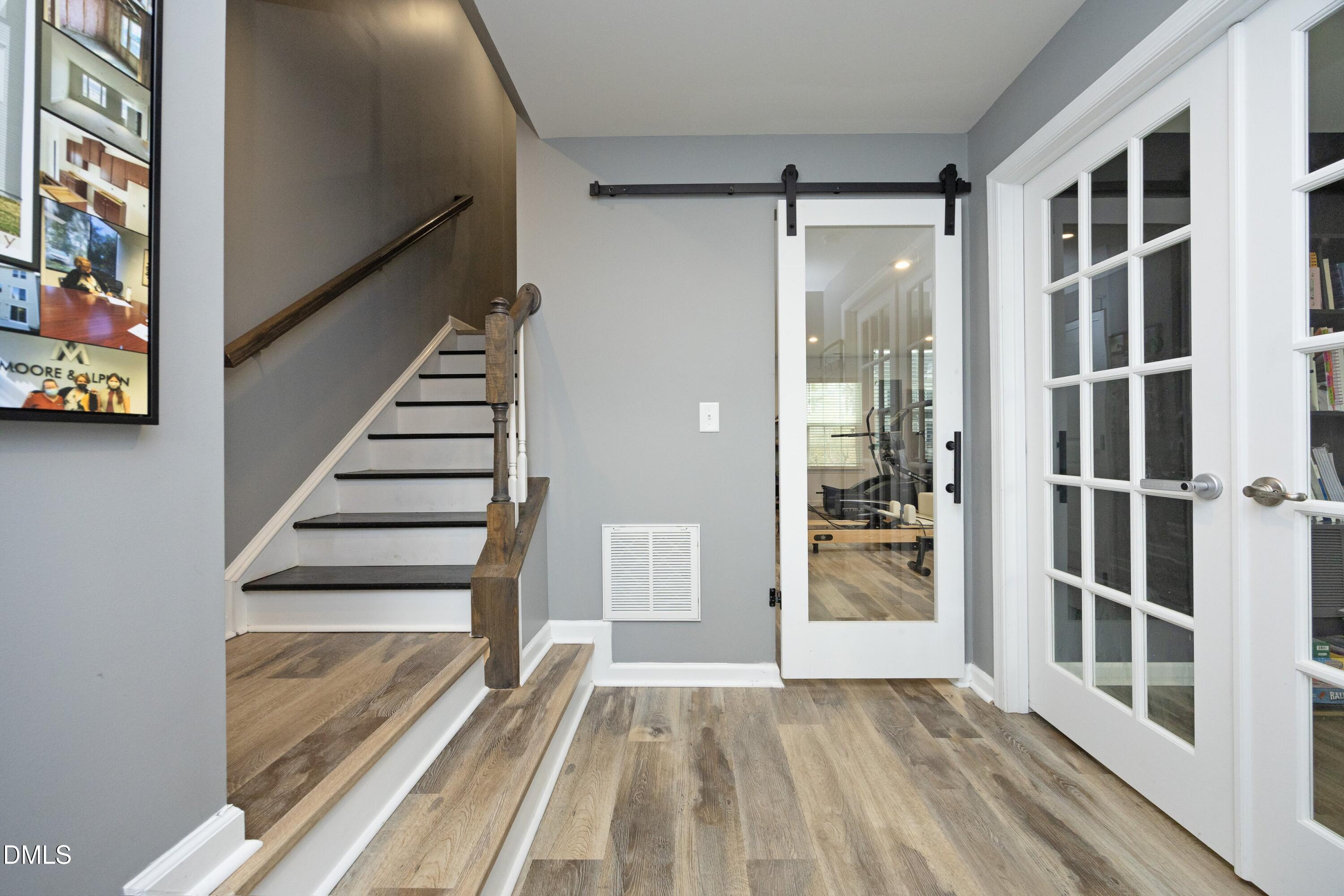 8716 Red Canyon Way Raleigh, NC 27616 - Photo 4 of 36 a view of an entryway with wooden floor and door