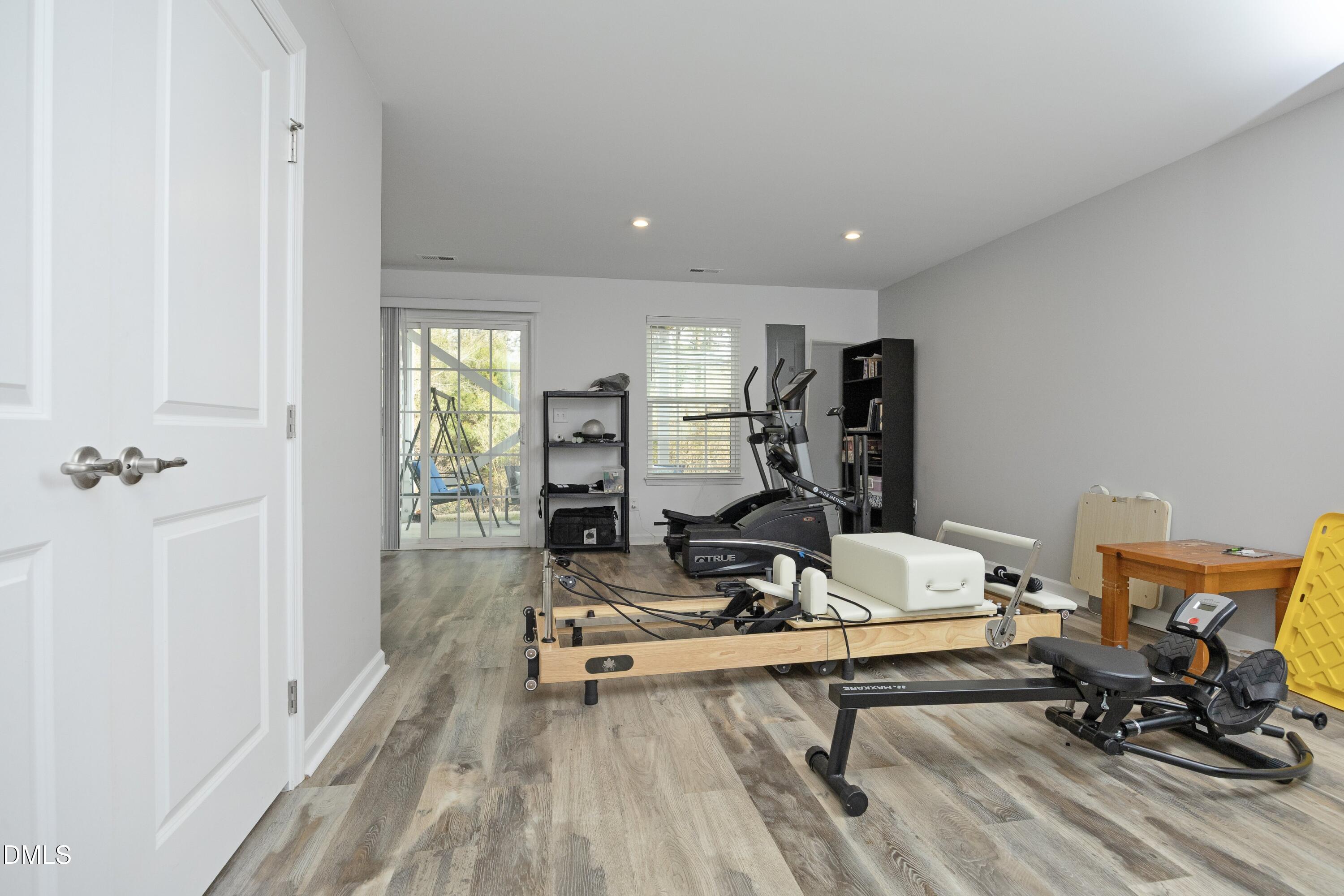 8716 Red Canyon Way Raleigh, NC 27616 - Photo 8 of 36 a view of a livingroom with workspace and a couch
