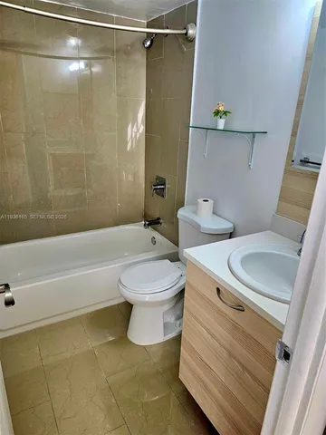 a kitchen with stainless steel appliances a refrigerator and a sink