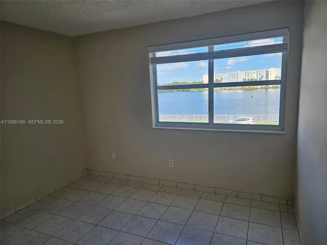 a kitchen with stainless steel appliances a stove microwave and sink