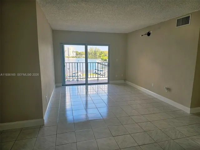 a kitchen with stainless steel appliances a refrigerator and a stove