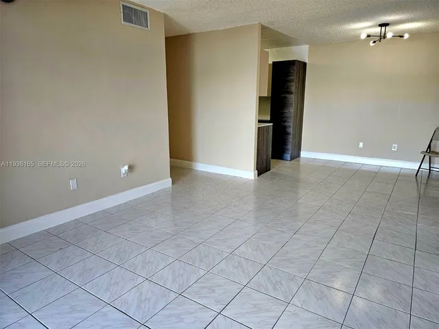 a kitchen with stainless steel appliances a refrigerator and a microwave