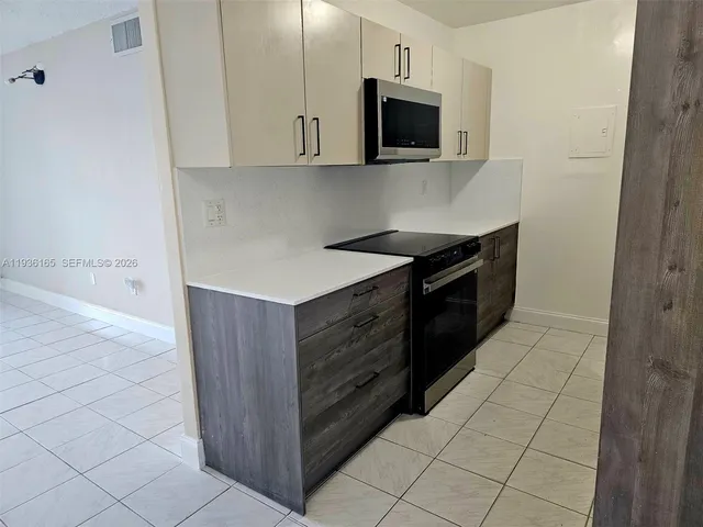 an empty room with a bathroom