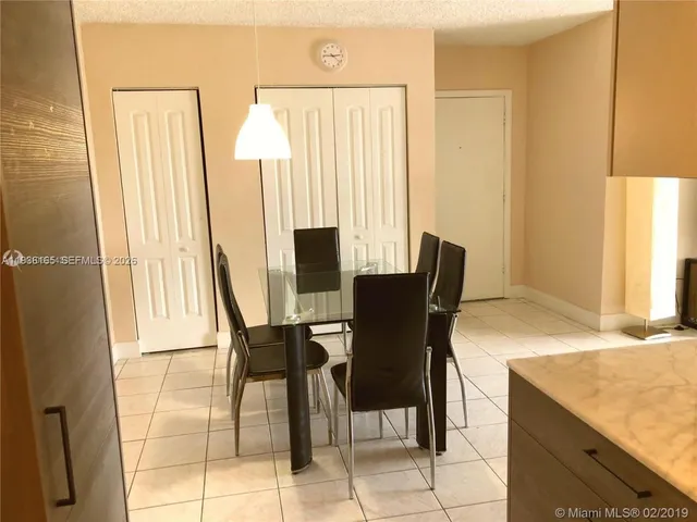 a kitchen with a sink stove and microwave