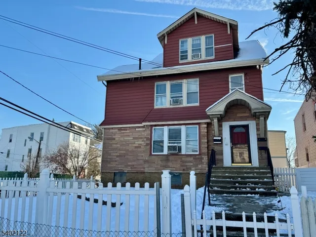 a front view of a house with glass windows