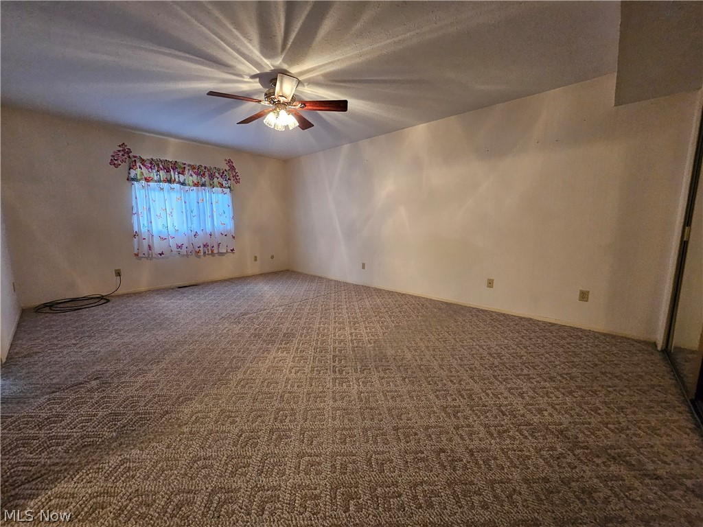 16551 Drake Road Strongsville, OH 44136 - Photo 36 of 50 Master bedroom with carpet floors and ceiling fan light
