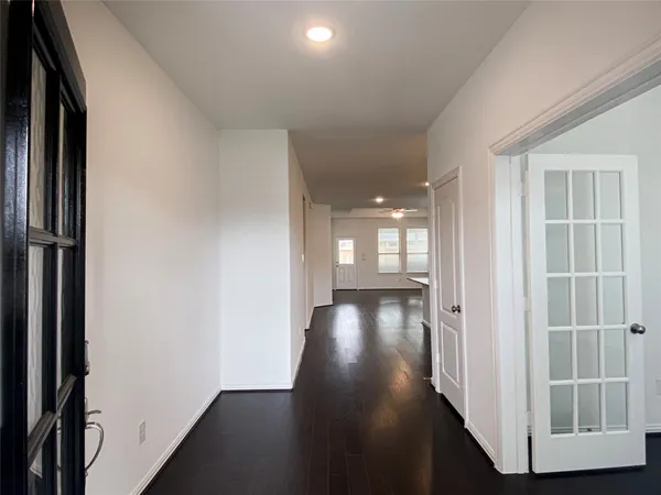 a view of gallery with wooden floor