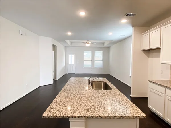 a kitchen with sink and window