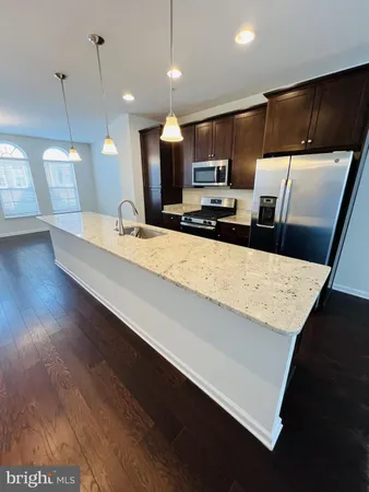 a large kitchen with a large island in it