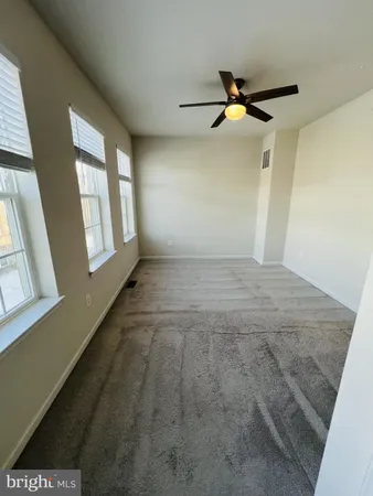 an empty room with a bench