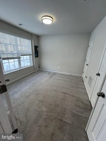 an empty room with a fireplace