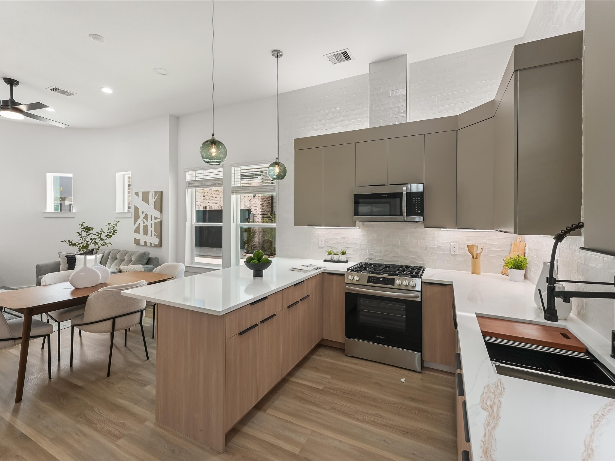 2598 West Tidwell Road Houston, TX 77091 - Photo 16 of 37 a kitchen with a sink stove and microwave