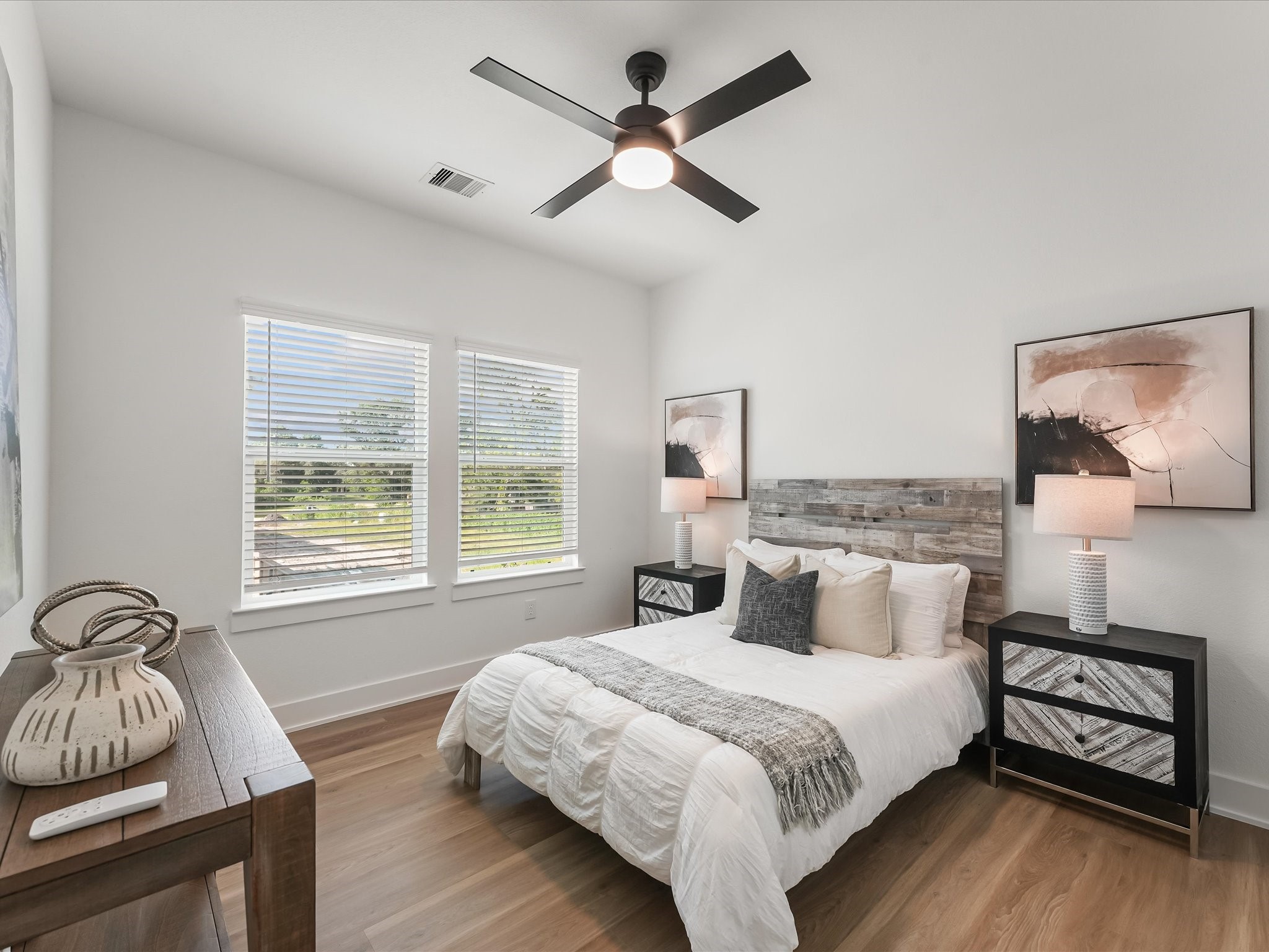 2598 West Tidwell Road Houston, TX 77091 - Photo 20 of 37 a bedroom with a bed and a window