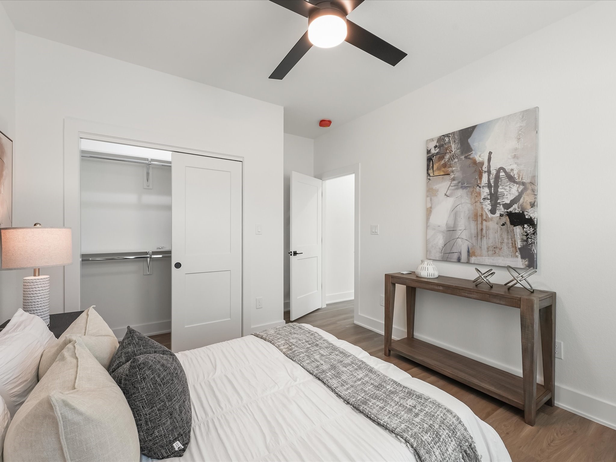 2598 West Tidwell Road Houston, TX 77091 - Photo 22 of 37 a bedroom with a bed and a chandelier