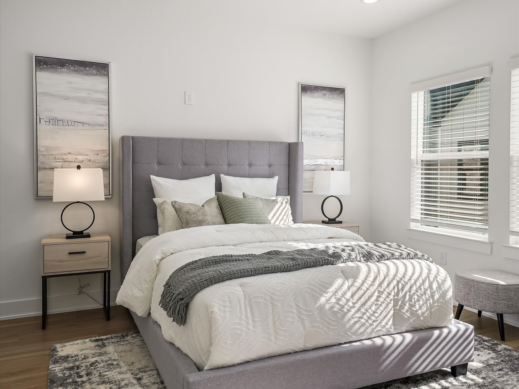 2598 West Tidwell Road Houston, TX 77091 - Photo 27 of 37 a bedroom with a bed and wooden floor