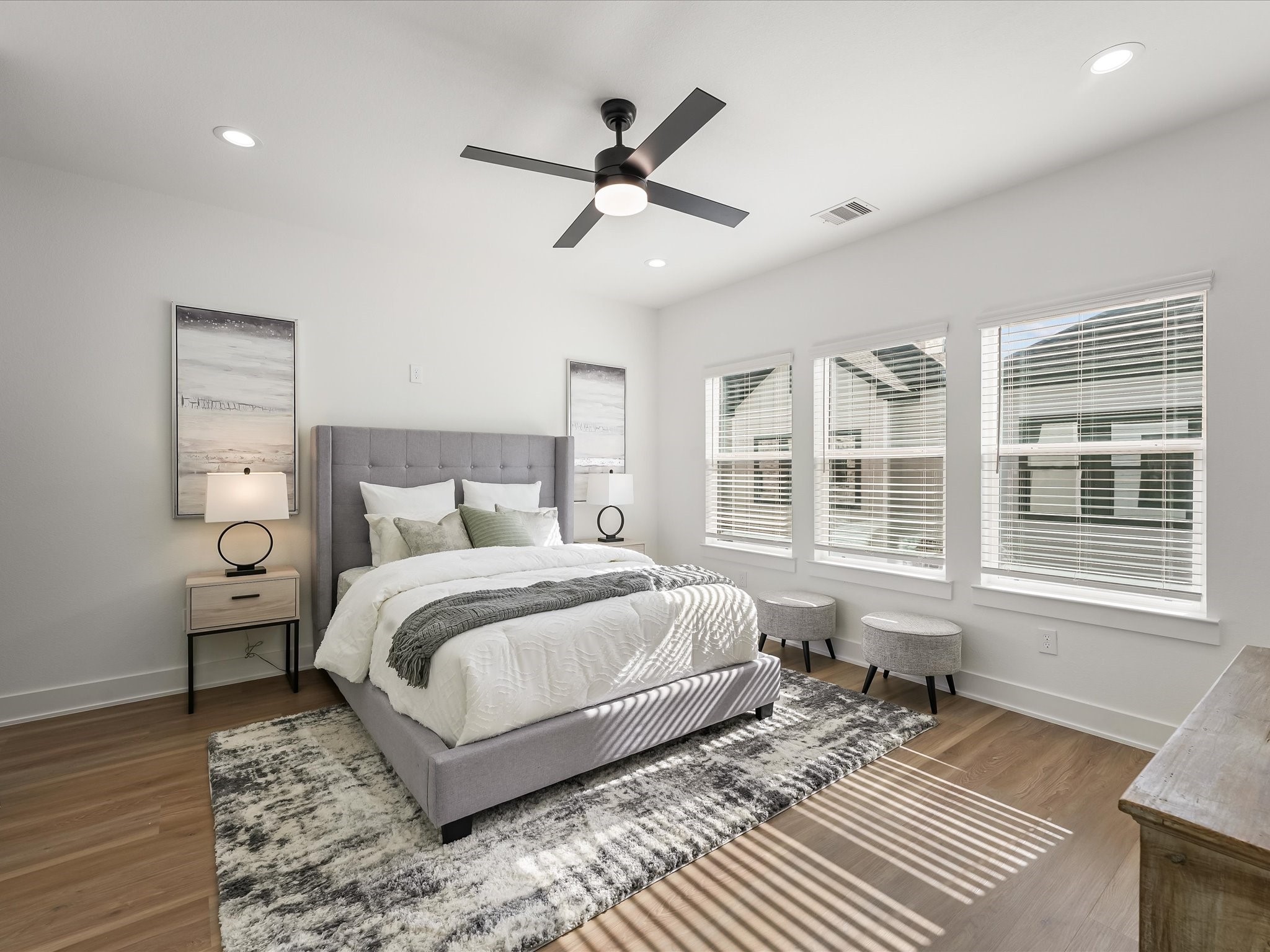 2598 West Tidwell Road Houston, TX 77091 - Photo 28 of 37 a bedroom with a large bed rug and a window