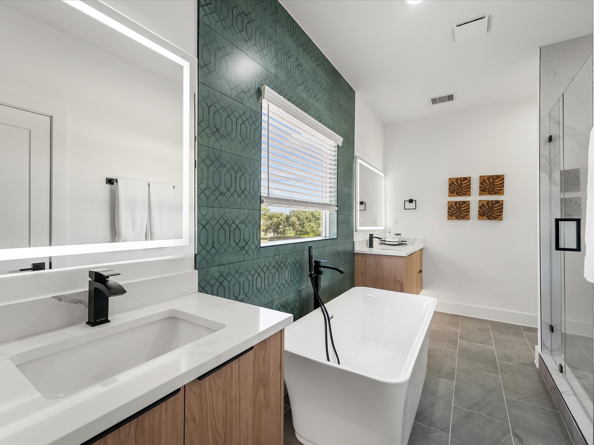 2598 West Tidwell Road Houston, TX 77091 - Photo 32 of 37 a bathroom with a sink a toilet and mirror