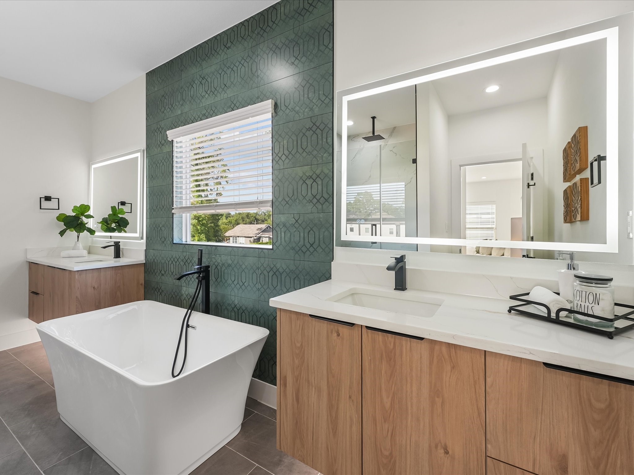 2598 West Tidwell Road Houston, TX 77091 - Photo 4 of 37 a bathroom with a tub sink and mirror