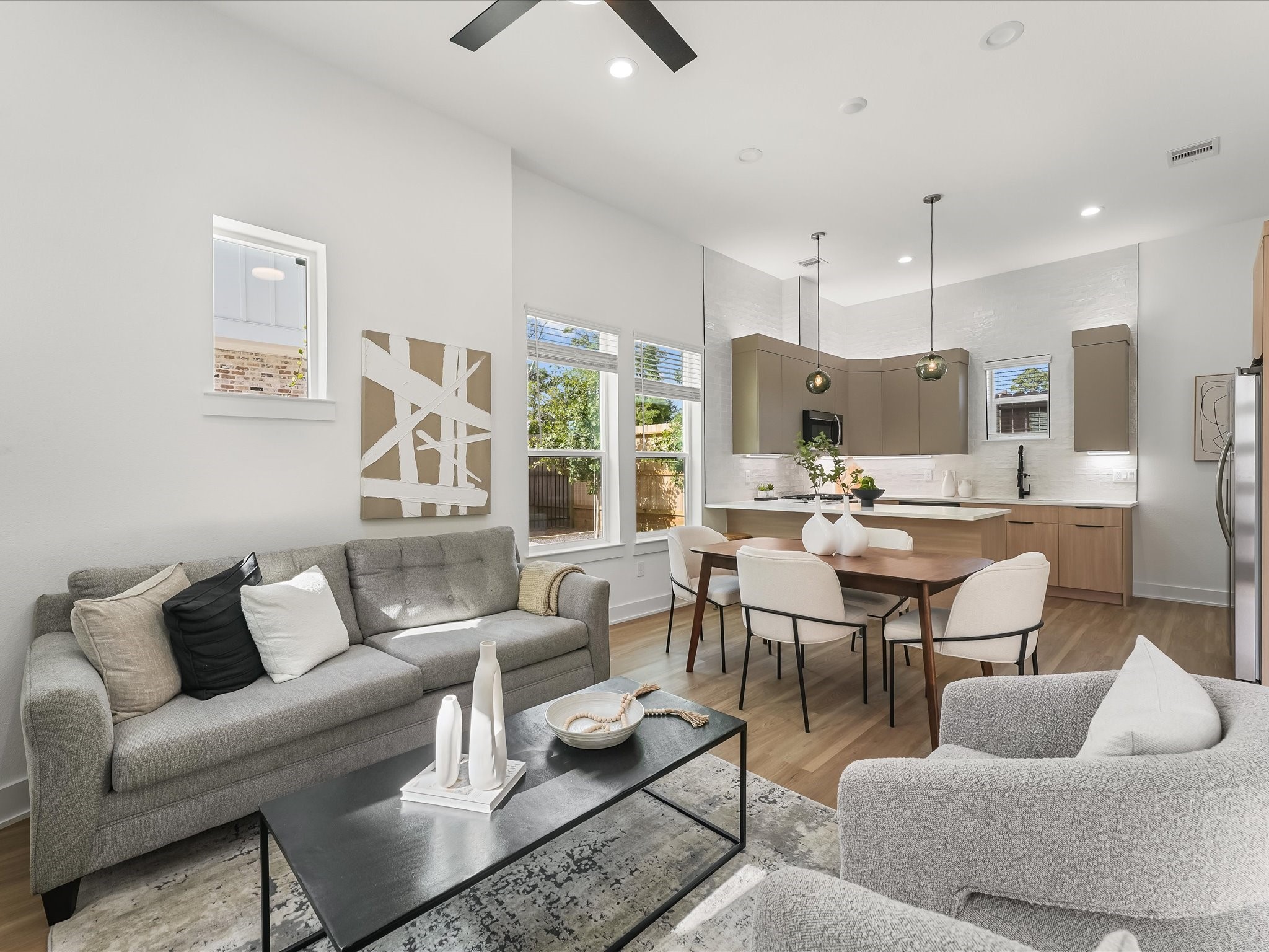 2598 West Tidwell Road Houston, TX 77091 - Photo 7 of 37 a living room with furniture kitchen view and a large window