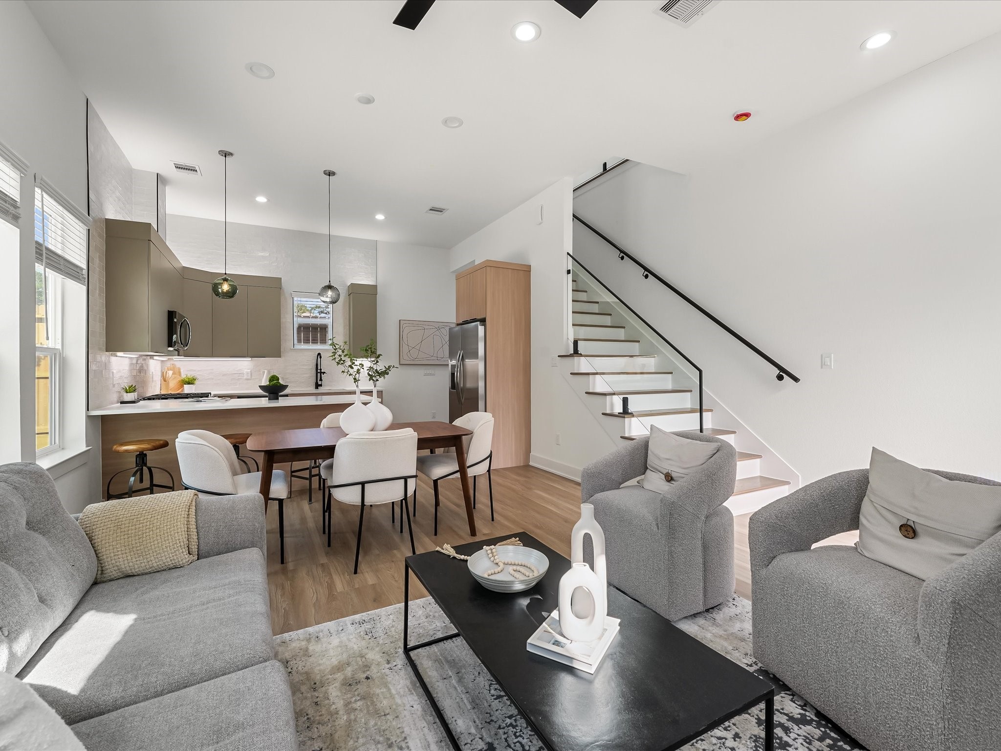 2598 West Tidwell Road Houston, TX 77091 - Photo 10 of 37 a living room with furniture kitchen view and a chandelier