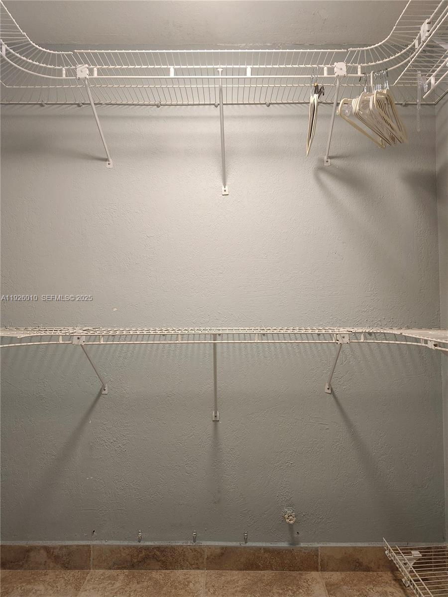 1666 West Avenue, Unit 312 Miami Beach, FL 33139 - Photo 12 of 42 a view of a room with racks on the wall