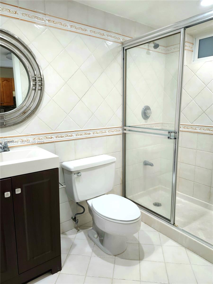 1666 West Avenue, Unit 312 Miami Beach, FL 33139 - Photo 17 of 42 a bathroom with a toilet and a shower