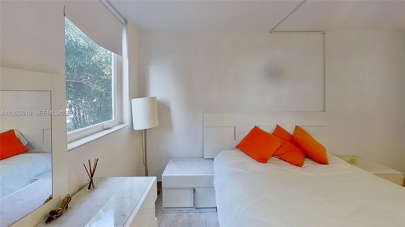 1666 West Avenue, Unit 312 Miami Beach, FL 33139 - Photo 2 of 42 a room with a bed and a window