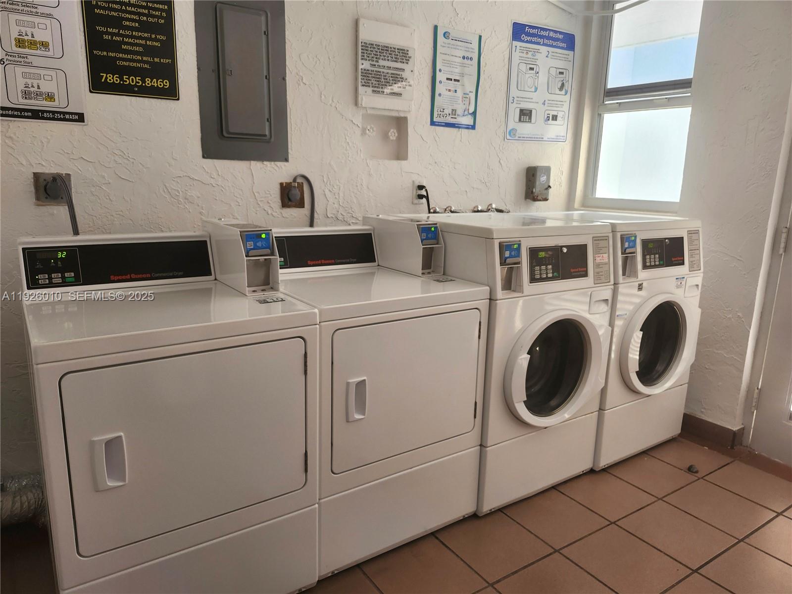 1666 West Avenue, Unit 312 Miami Beach, FL 33139 - Photo 25 of 42 a utility room with dryer and washer