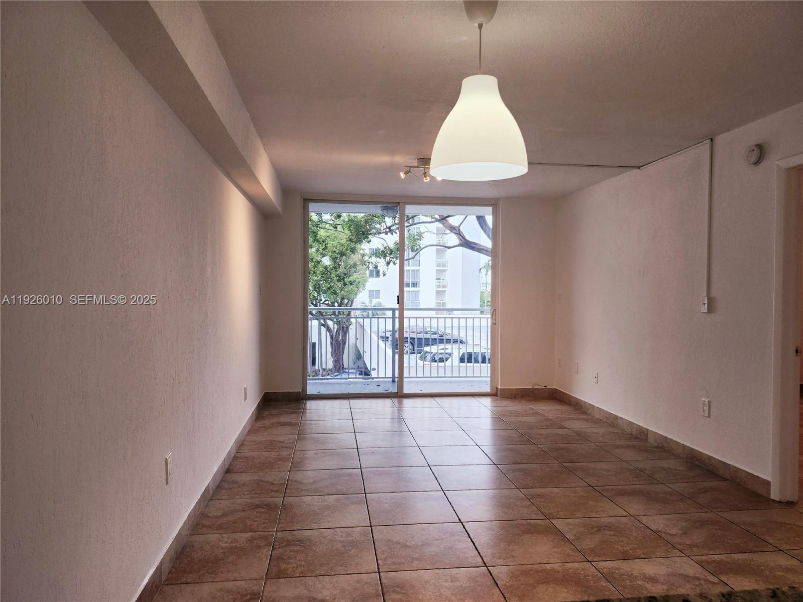 1666 West Avenue, Unit 312 Miami Beach, FL 33139 - Photo 7 of 42 a view of an empty room with a window