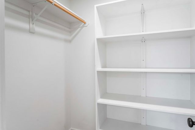 a view of an empty walk in closet