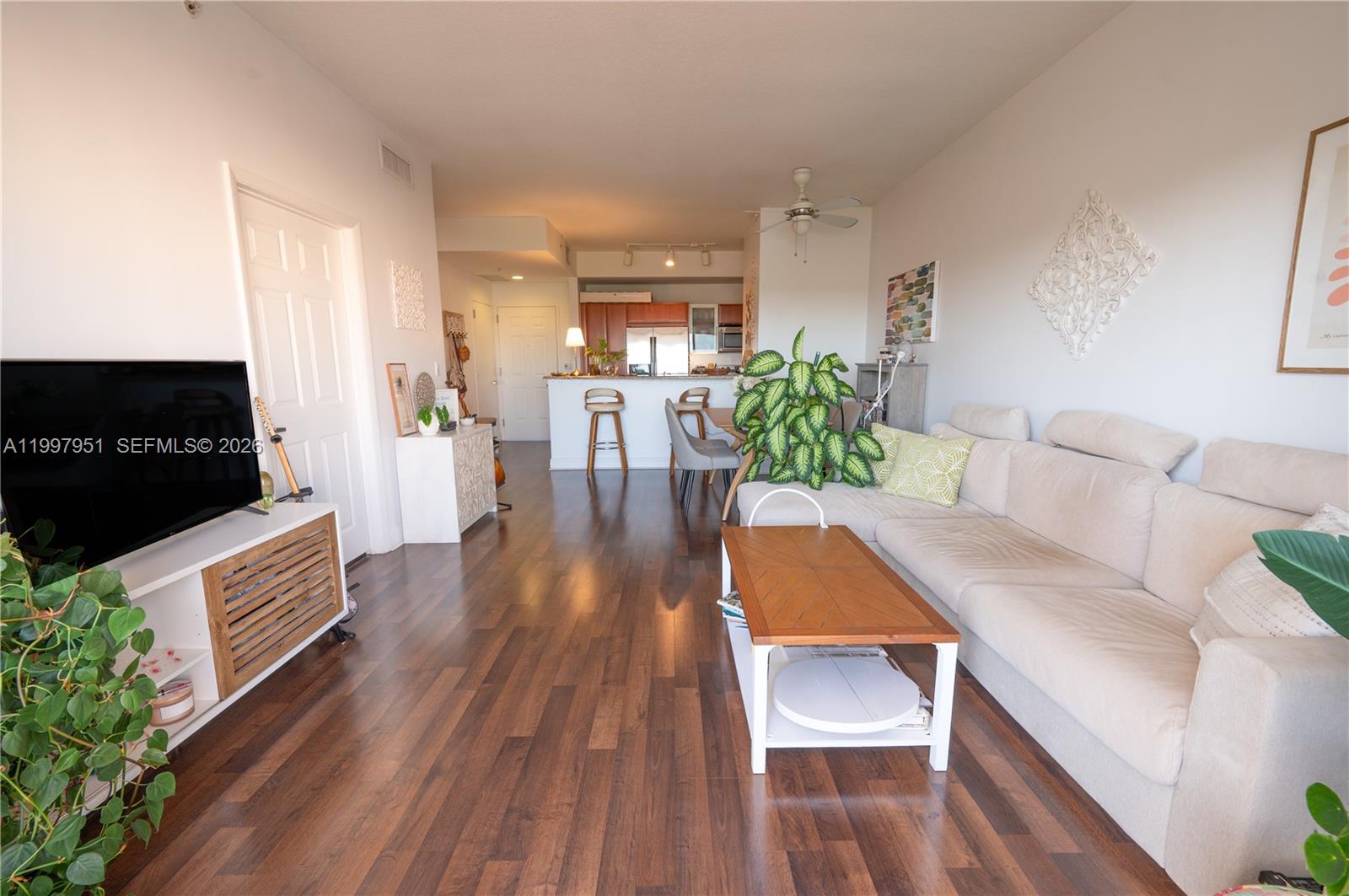 3232 Southwest 22nd Terrace, Unit 607 Miami, FL 33145 - Photo 2 of 20 a living room with furniture and a wooden floor