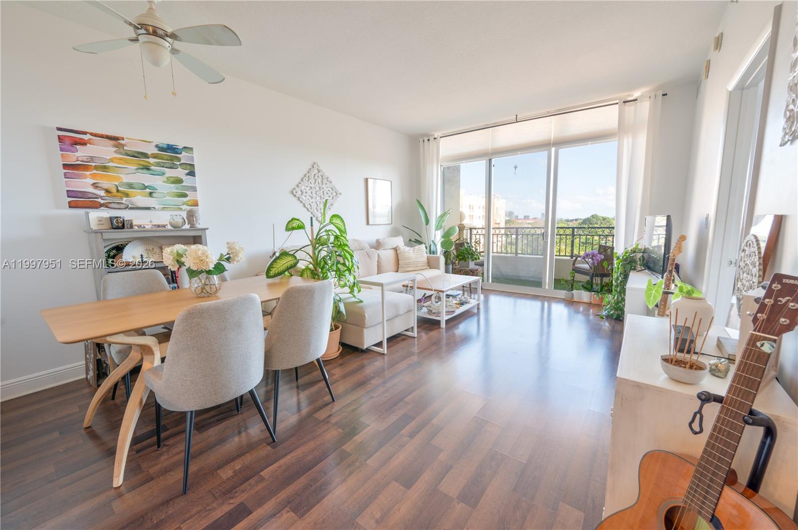 3232 Southwest 22nd Terrace, Unit 607 Miami, FL 33145 - Photo 3 of 20 a living room with furniture and a large window