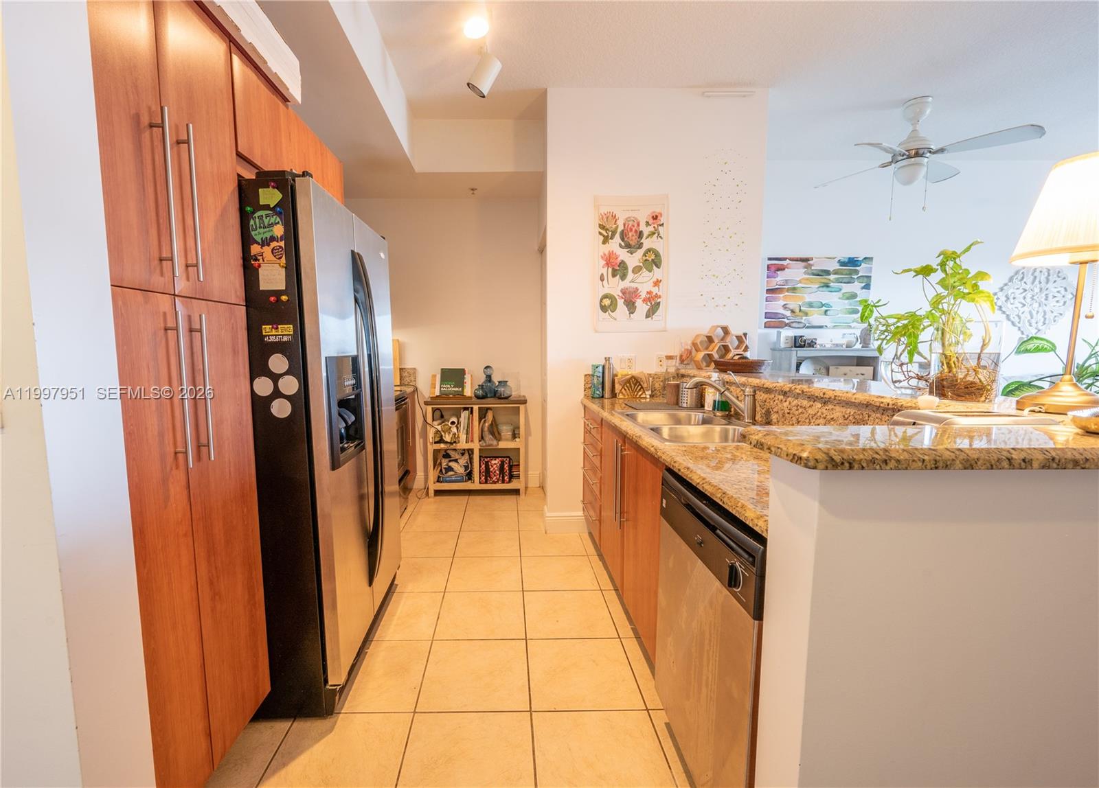 3232 Southwest 22nd Terrace, Unit 607 Miami, FL 33145 - Photo 7 of 20 a kitchen with stainless steel appliances granite countertop a refrigerator and a sink