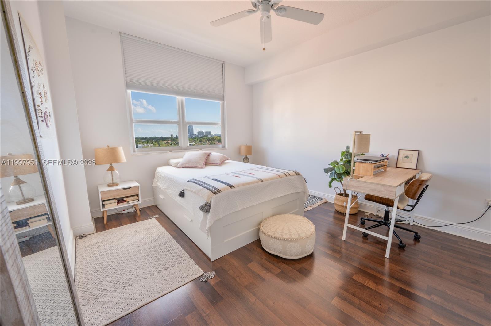 3232 Southwest 22nd Terrace, Unit 607 Miami, FL 33145 - Photo 9 of 20 a bed room with a bed and a chair