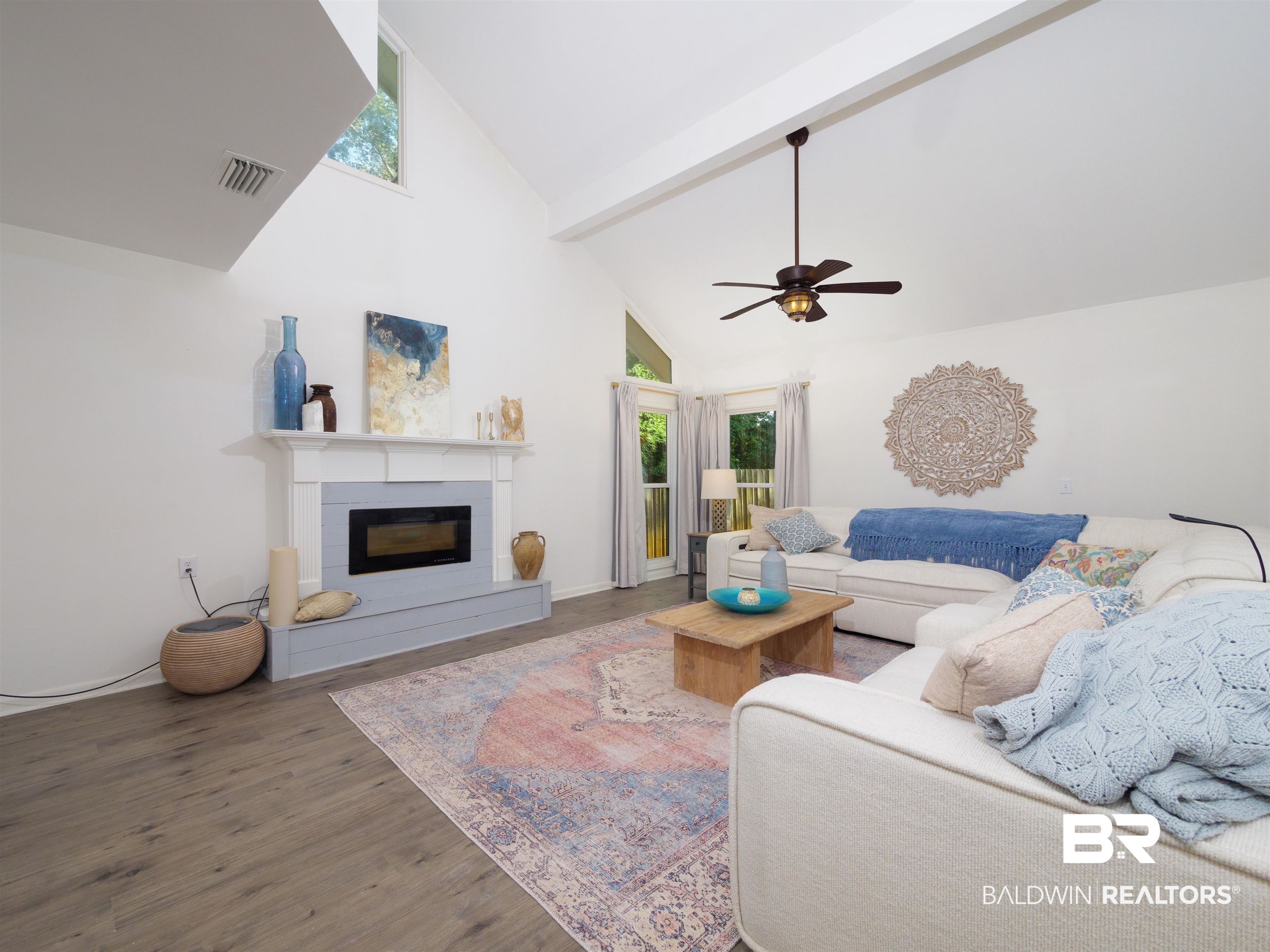 494 Ridgewood Drive Daphne, AL 36526 - Photo 14 of 40 Living room featuring beam ceiling, wood-type flooring, high vaulted ceiling, and ceiling fan