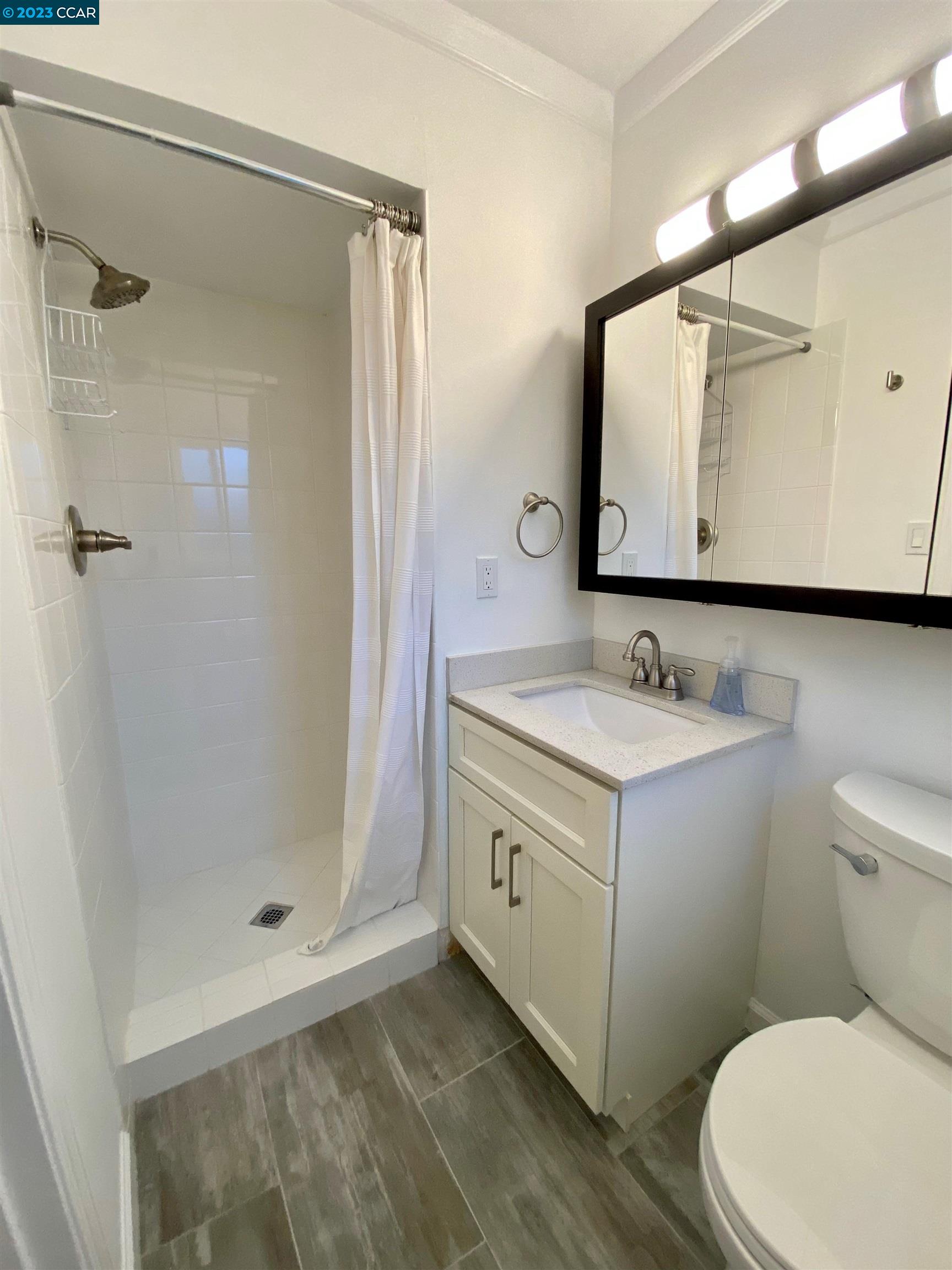 959 Duar Drive Concord, CA 94518 - Photo 11 of 14 a bathroom with a double vanity sink mirror and toilet